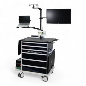 Medical cart with clinical engineering label, monitors, and laptop on a white background